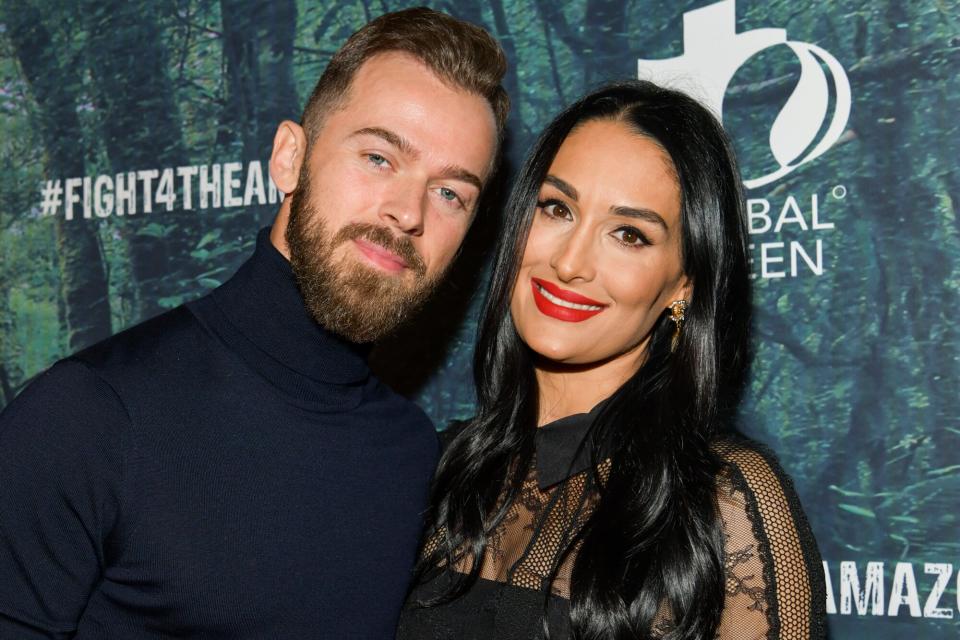 Artem Chigvintsev (L) and Nikki Bella attend the PUBG Mobile's #FIGHT4THEAMAZON Event at Avalon Hollywood on December 09, 2019 in Los Angeles, California.