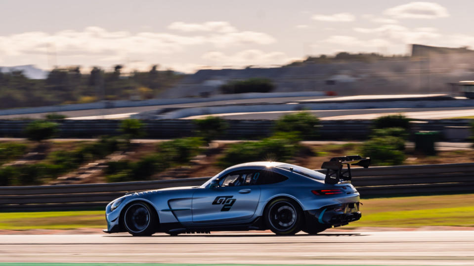 Driving the Mercedes-AMG GT2 race car on track.