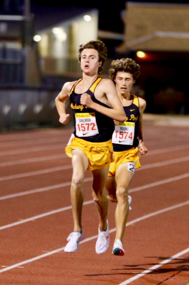 Newbury Park junior Colin Sahlman (left) sprints to the finish line pursued closely by sophomore teammate Lex Young.