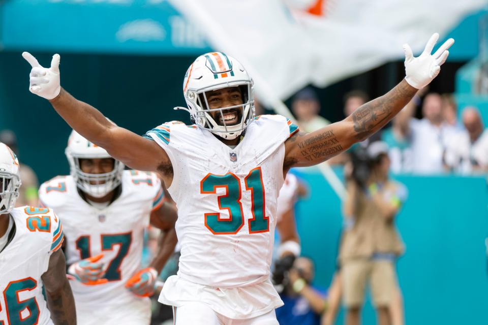 The Dolphins' Raheem Mostert leads the NFL this season with 10 rushing touchdowns, including this one in Week 8 against the Patriots.