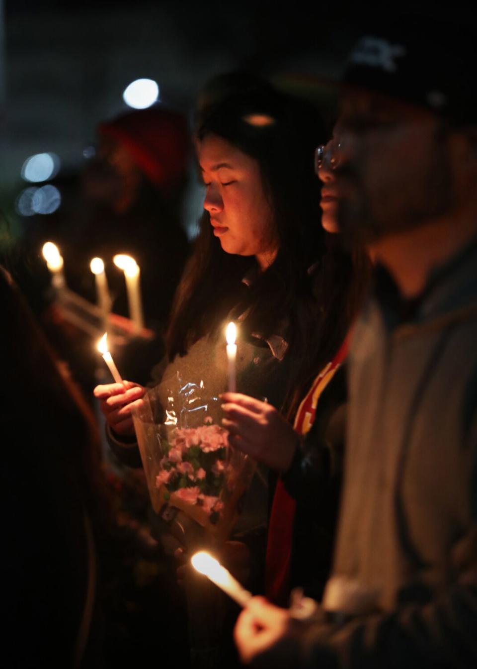 Mourners take part in a vigil for victims of the Monterey Park mass shooting at Star Ballroom Dance Studio on Monday.