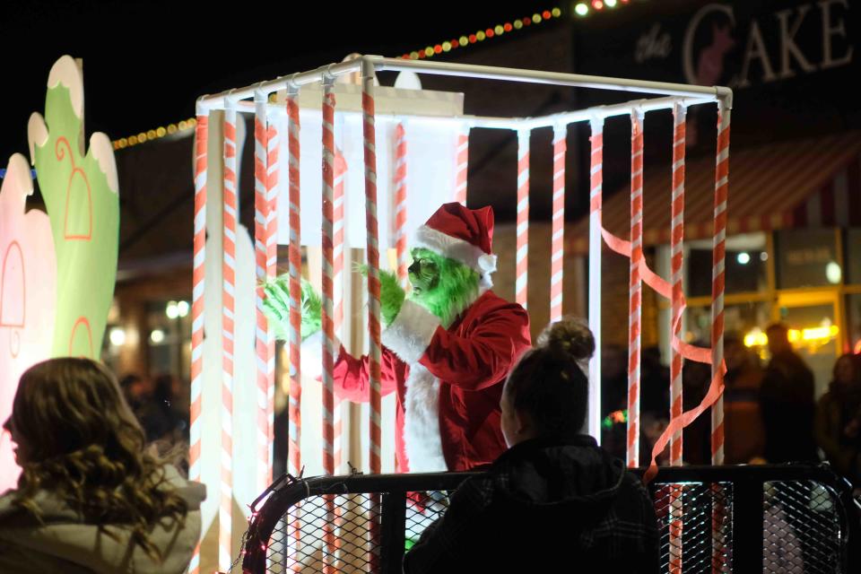 Confined but not silenced the Grinch makes an appearance Saturday night at the Parade of Lights in Canyon, Texas.