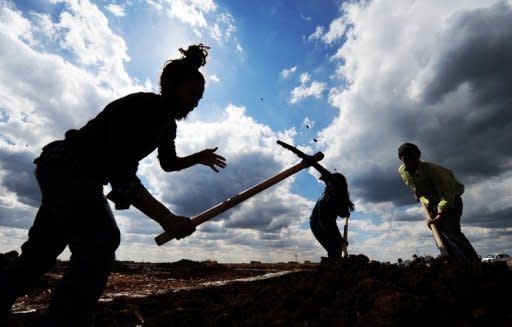 People are seen here working at a building site at Viransehir in Urfa. Kurds are building their own village near Viransehir city, using the stones they cut from volcanic rocks that can be found all around. Democratic Society Congress (DTK), an umbrella organization for local Kurdish groups in southeast Turkey, and an activist, Metin Yegin, jointly organize the project