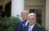 FILE PHOTO: FILE PHOTO: FILE PHOTO: U.S. President Donald Trump looks on as Jerome Powell, his nominee to become chairman of the U.S. Federal Reserve, speaks at the White House in Washington