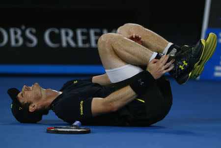 Tennis - Australian Open - Melbourne Park, Melbourne, Australia - 18/1/17 Britain's Andy Murray falls onto the court during his Men's singles second round match against Russia's Andrey Rublev. REUTERS/Thomas Peter