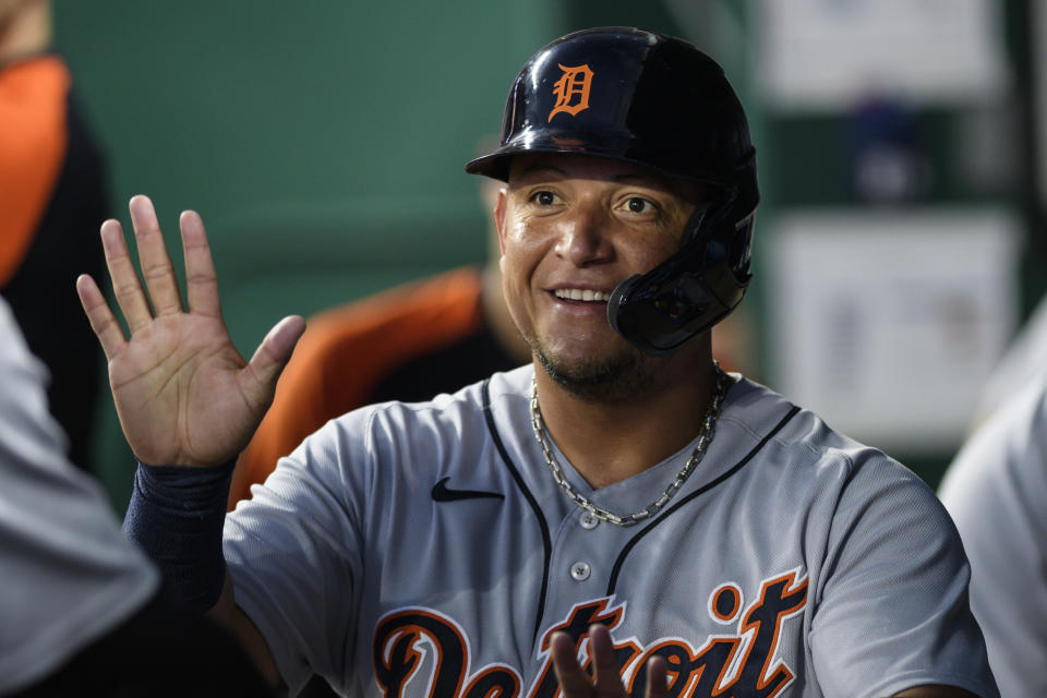 The Detroit Tigers' Miguel Cabrera is congratulated by teammates after scoring against the Kansas City Royals during the sixth inning of a baseball game in Kansas City, Mo., Tuesday, June 15, 2021. (AP Photo/Reed Hoffmann)