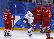 Ice Hockey - Pyeongchang 2018 Winter Olympics - Men's Quarterfinal Match - Olympic Athletes from Russia v Norway - Gangneung Hockey Centre, Gangneung, South Korea - February 21, 2018 - Ivan Telegin, an Olympic Athlete from Russia (7), celebrates his third period goal with teammates. REUTERS/Brian Snyder