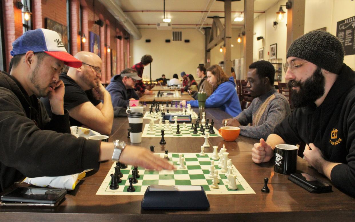 Dustin Hopkins of Princeton, right, waits as his opponent makes his next move in one of many rounds of "Bullet" style — two-minute apiece — chess games.