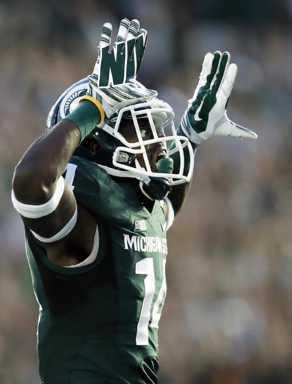Michigan State wide receiver Tony Lippett celebrates his touchdown against Stanford during the second half of the Rose Bowl NCAA college football game on Wednesday, Jan. 1, 2014, in Pasadena, Calif. (AP Photo/Danny Moloshok)
