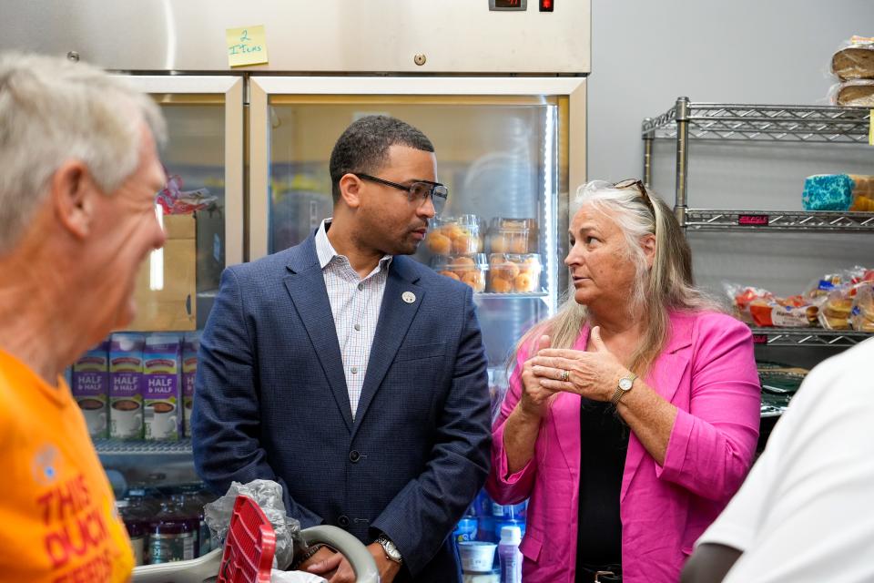 Carol Young, right, a vice president at Development Systems International, speaks with Ohio Rep. Sedrick Denson during a tour of the community center on Friday, July 21, 2023, at Valley Interfaith Community Resource Center in Village of Lockland in Cincinnati.