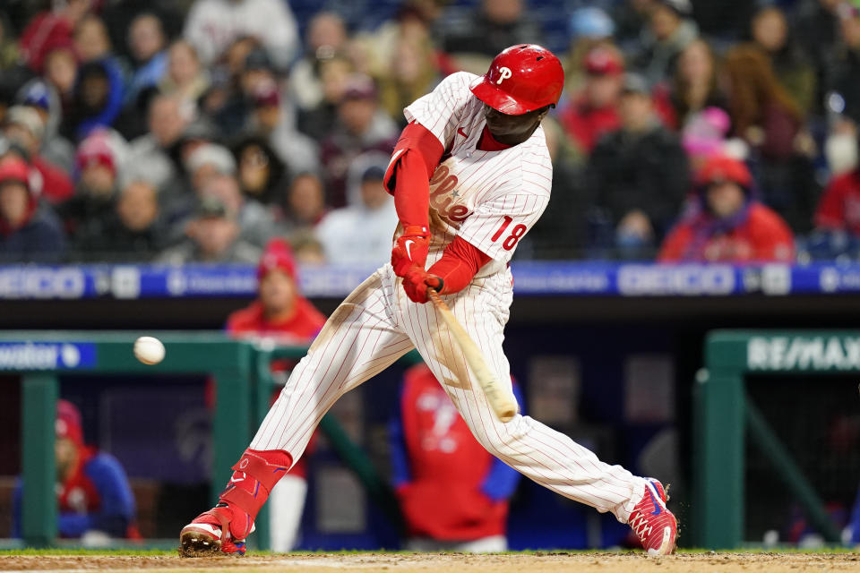 Philadelphia Phillies' Didi Gregorius hits a run-scoring double against Colorado Rockies pitcher Ryan Feltner during the third inning of a baseball game, Wednesday, April 27, 2022, in Philadelphia. (AP Photo/Matt Slocum)