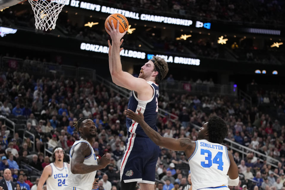 Gonzaga's Drew Timme goes up for a shot while defended by UCLA's David Singleton (34) in the first half of a Sweet 16 college basketball game in the West Regional of the NCAA Tournament, Thursday, March 23, 2023, in Las Vegas. (AP Photo/John Locher)