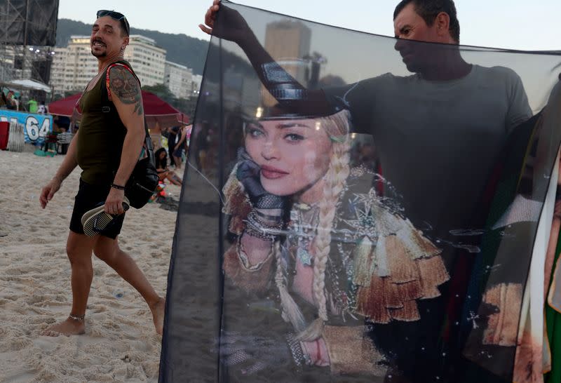 People gather for Madonna's concert at Copacabana beach, in Rio de Janeiro