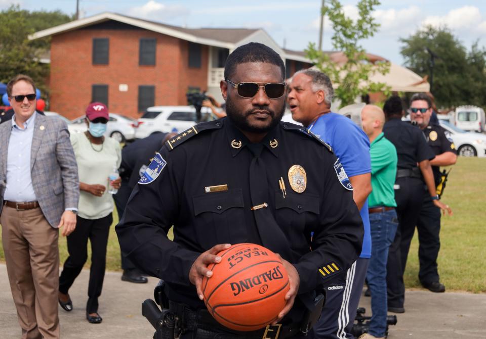 SPD Interim Chief Lenny Gunther prepares to play basketball during National Night Out on Tuesday, Aug. 2 on the courts located at Herbert Kayton Homes on W. Gwinnett St.