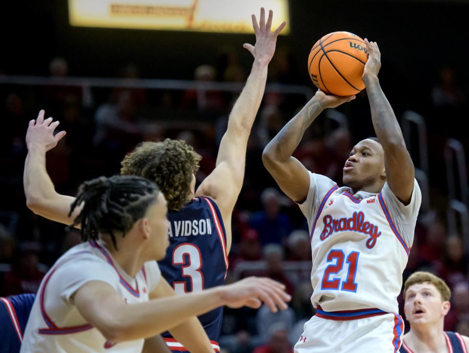 Bradley's Duke Deen launches a three-pointer over Belmont's Keishawn Davisdson in the first half of their Missouri Valley Conference basketball game Saturday, Jan. 20, 2024 at Carver Arena in Peoria.