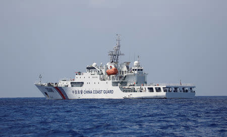 A China Coast Guard vessel patrols at the disputed Scarborough Shoal April 6, 2017. Picture taken April 6, 2017 REUTERS/Erik De Castro