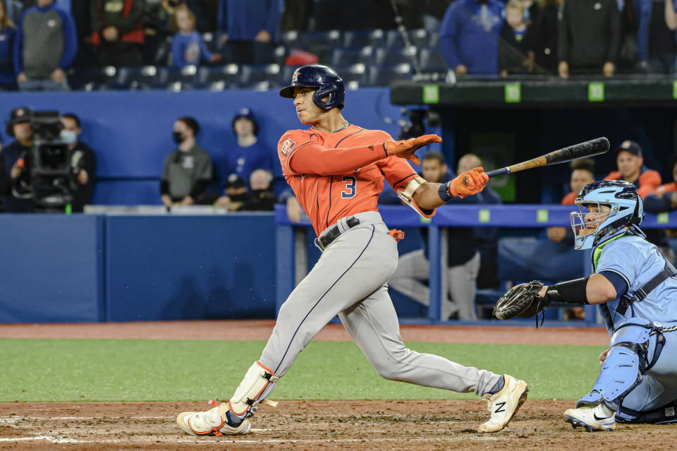 Houston Astros' Jeremy Pena (3) hits a foul ball during the ninth inning of a baseball game against the Toronto Blue Jays in Toronto, Sunday, May 1, 2022. (Christopher Katsarov/The Canadian Press via AP)