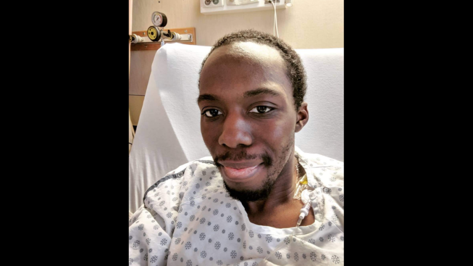Josh Jones is pictured in a Calgary, Canada, hospital receiving treatment for cancer in 2019. He was still in treatment when he lost his position with the Kansas City Symphony