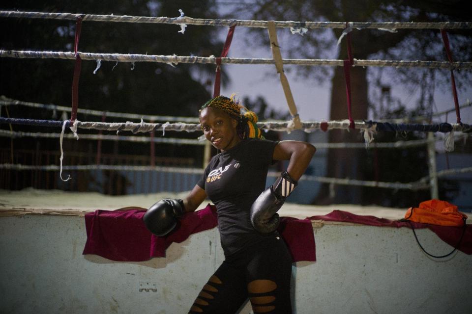 In this Jan. 24, 2017 photo, boxer Legnis Cala poses for a photo before a training session, at a sports center in Havana, Cuba. Women were first allowed to box at the Olympics during the 2012 Summer Olympics but they are still not allowed to box in Cuba. (AP Photo/Ramon Espinosa)