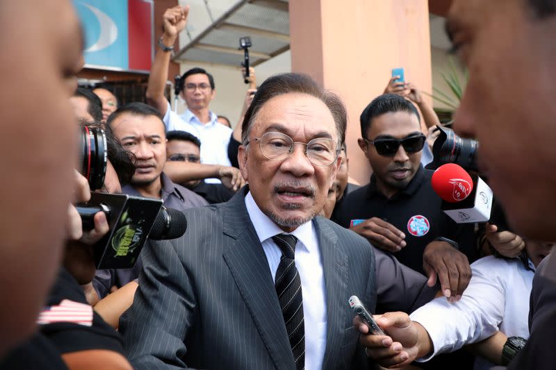 Malaysia's politician Anwar Ibrahim leaves People's Justice Party headquarters after a meeting in Petaling Jaya