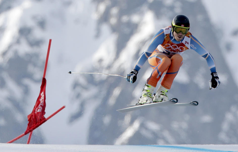 Gold medal winner Norway's Kjetil Jansrud makes a jump in the men's super-G at the Sochi 2014 Winter Olympics, Sunday, Feb. 16, 2014, in Krasnaya Polyana, Russia. (AP Photo/Charlie Riedel)