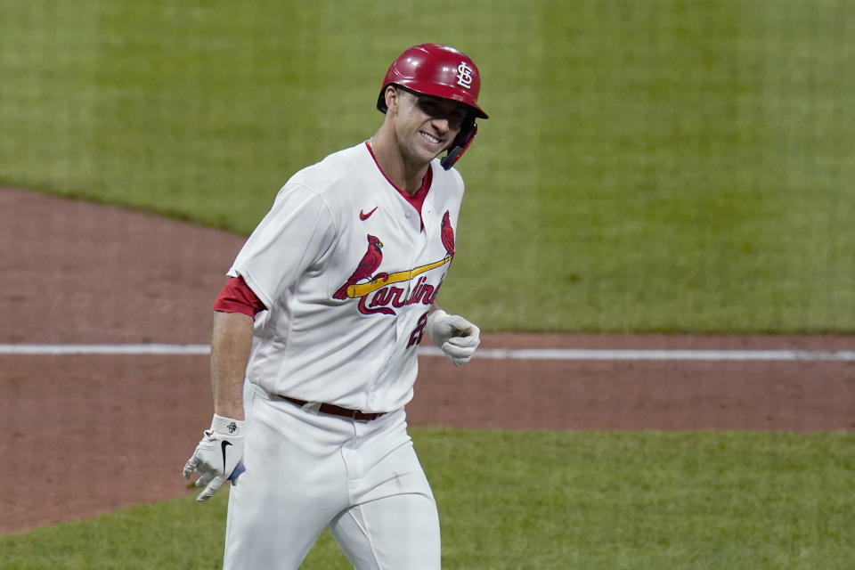 St. Louis Cardinals' Jack Flaherty smiles after hitting a solo home run during the third inning of a baseball game against the Colorado Rockies Friday, May 7, 2021, in St. Louis. (AP Photo/Jeff Roberson)