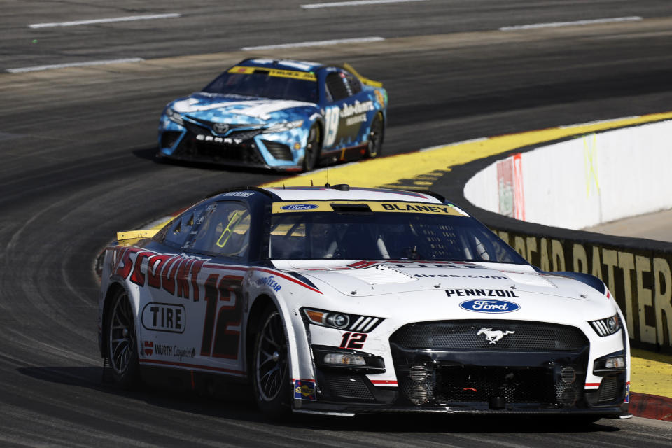 MARTINSVILLE, VIRGINIA - OCTOBER 29: Ryan Blaney, driver of the #12 Discount Tire Ford, and Martin Truex Jr., driver of the #19 Auto-Owners Insurance Toyota, race during the NASCAR Cup Series Xfinity 500 at Martinsville Speedway on October 29, 2023 in Martinsville, Virginia. (Photo by Chris Graythen/Getty Images)