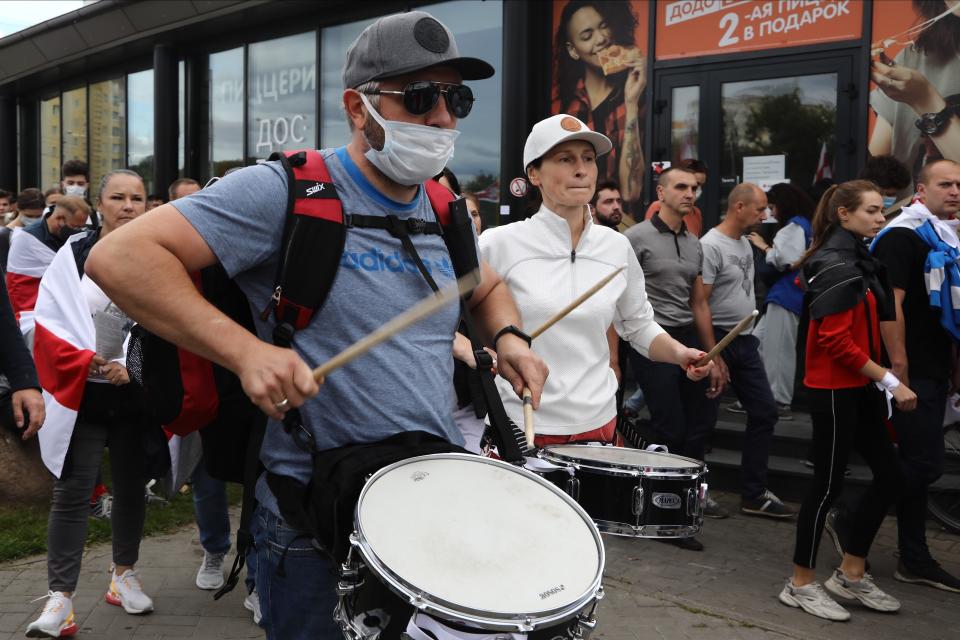 Protesters beat the drums during a Belarusian opposition supporters' rally protesting the official presidential election results in Minsk, Belarus, Sunday, Sept. 13, 2020. Protests calling for the Belarusian president's resignation have broken out daily since the Aug. 9 presidential election that officials say handed him a sixth term in office. (TUT.by via AP)