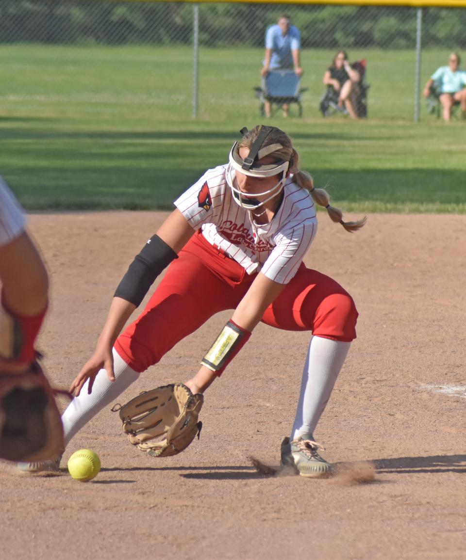 Coldwater's Mackenzie Scheid field a Marshall bunt attempt for an out Tuesday in district play