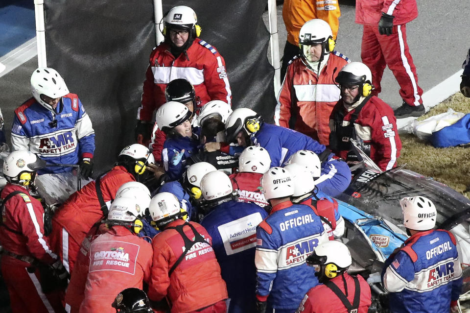 Ryan Newman is removed from his race car after crashing during the NASCAR Daytona 500 auto race at Daytona International Speedway, Monday, Feb. 17, 2020, in Daytona Beach, Fla. (AP Photo/David Graham)