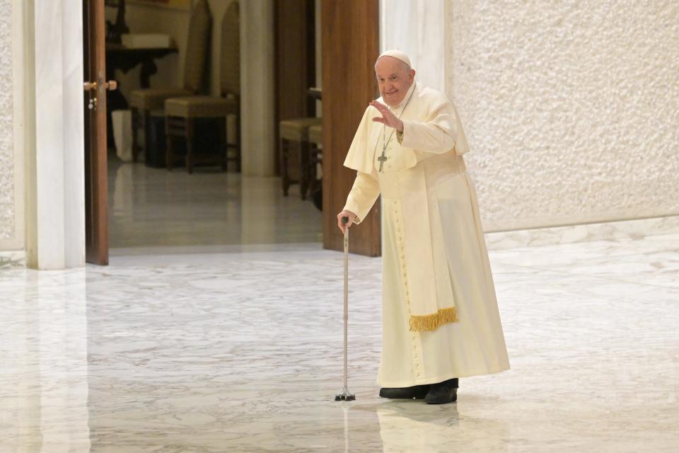 Pope Francis leaves after an audience to the participants of the live nativity scene of Santa Maria Maggiore on Saturday at Paul-VI hall in The Vatican.