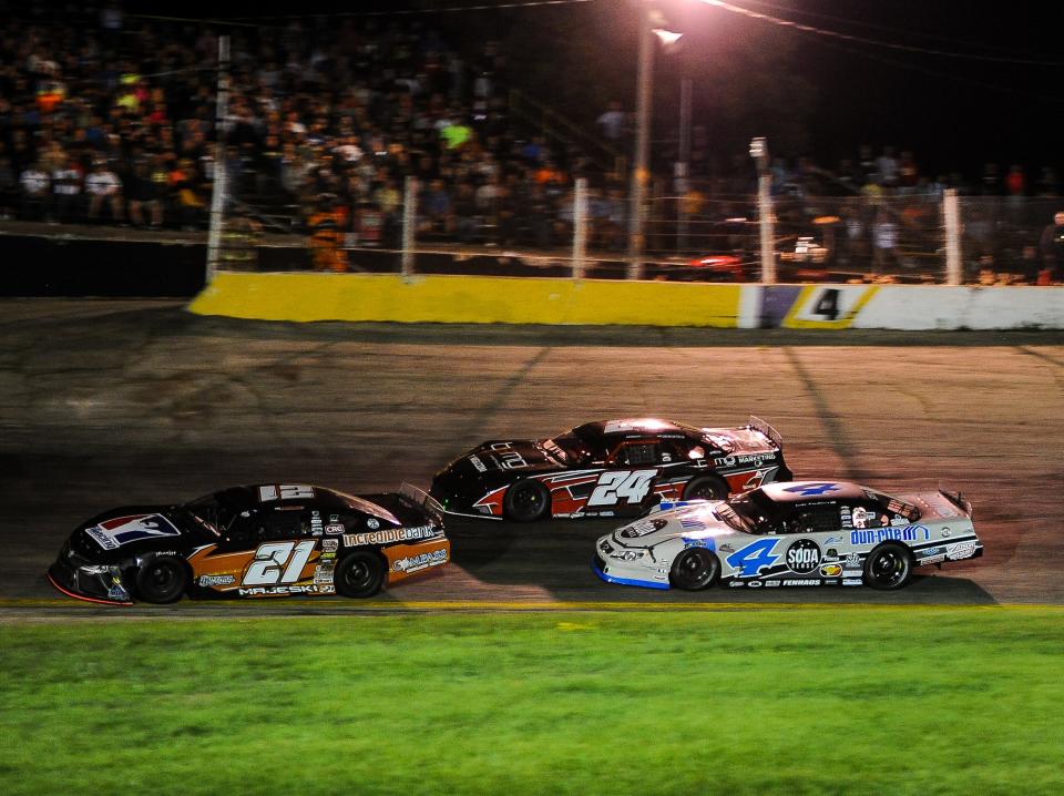 Ty Majeski (21), William Byron (24) and Luke Fenhaus race for the lead.