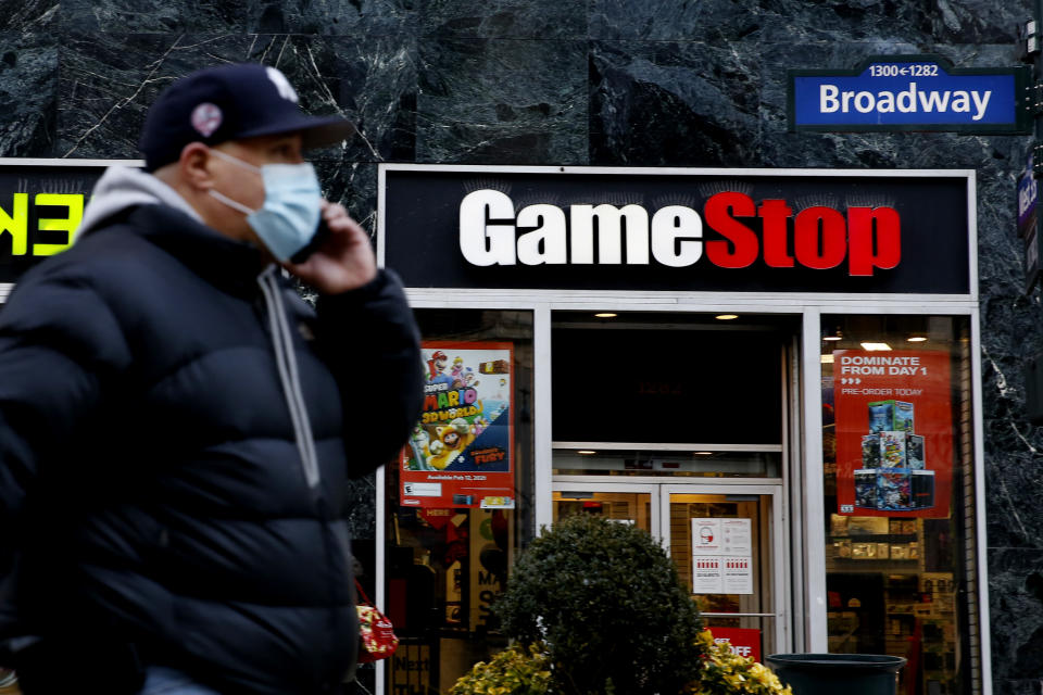 NEW YORK, NEW YORK - FEBRUARY 25: A man talks by his phone in front of GameStop at 6th Avenue on February 25, 2021 in New York. GameStop Corp. doubled its shares and and jumped another 19 percent today and the betting are that GameStop shares would spike to $800 on Friday. (Photo by John Smith/VIEWpress via Getty Images)