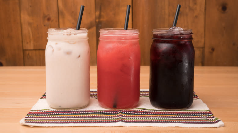 three varieties of agua fresca in mason jars