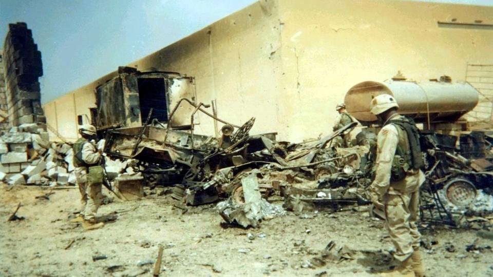 Soldiers from 2nd Brigade, 3rd Infantry Division inspect wreckage from an Iraqi ballistic missile strike on the brigade operations center that occurred on April 7, 2003. (Capt. William Glaser/Army)