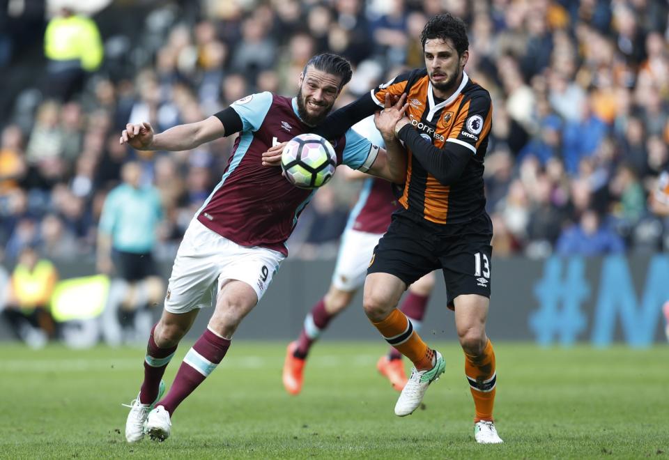 <p>West Ham United’s Andy Carroll in action with Hull City’s Andrea Ranocchia </p>