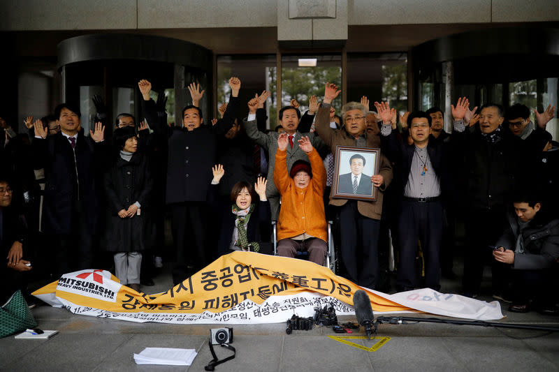 FILE PHOTO: Kim Seong-ju, a victim of wartime forced labor during the Japanese colonial period, cheers with her supporters and relatives of another victims after hearing the court ruling at the Supreme Court in Seoul, South Korea, November 29, 2018. REUTERS/Kim Hong-Ji