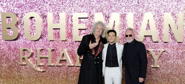 US actor Rami Malek (C) poses on the red carpet with Queen's guitarist Brian May (L) and drummer Roger Taylor