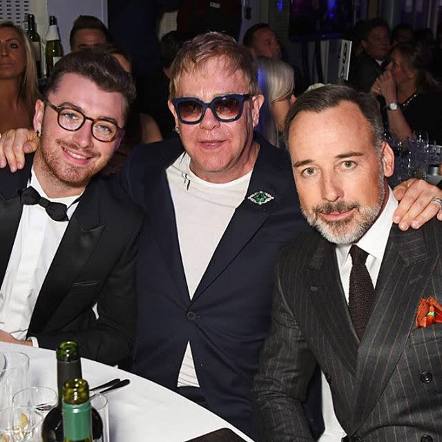 <p>The musical artist sat between singer extroardinare Sam Smith and his lovable hubby and posted the pic to congratulate Smith on his James Bond theme song for <em>Spectre.</em></p>