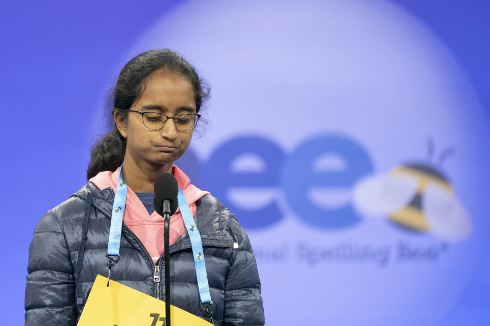 Amaani Charan, 14, of San Jose, Calif., reacts to misspelling her word during the quarterfinal round of competition in the Scripps National Spelling Bee, in Oxon Hill, Md., Wednesday, May 29, 2024. (AP Photo/Nathan Howard)