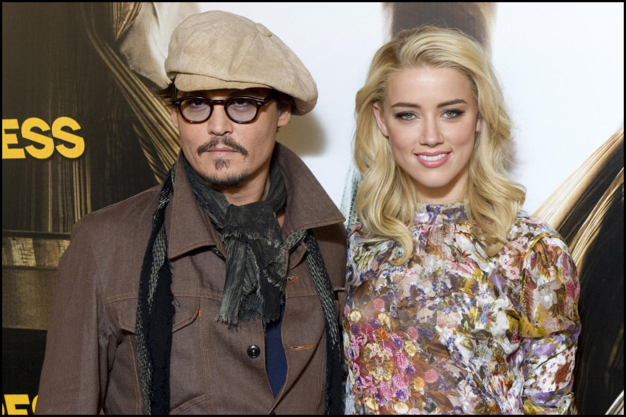 Johnny Depp and Amber Heard attend the "Rum Express" (Rum Diary) Photocall, in Paris. (Photo by Stephane Cardinale/Corbis via Getty Images)