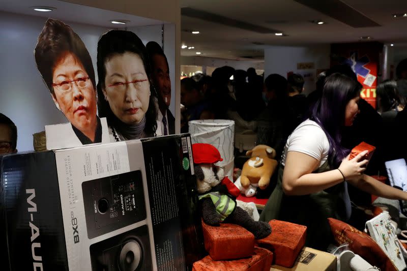 Images of Hong Kong's Chief Executive Lam and Justice Secretary Cheng Yuet-wah are seen at a booth of independent fairs, selling protest-themed artwork, toys and accessories, ahead of Lunar New Year in Hong Kong