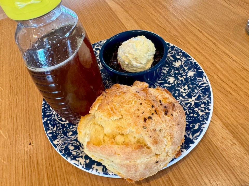 A biscuit with honey at Tupelo Honey Southern Kitchen in Irving, Texas, December 28, 2023.