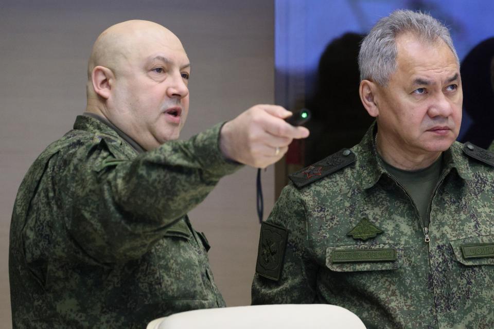 FILE - The top Russian military commander in Ukraine, Gen. Sergei Surovikin, left, and Russian Defense Minister Sergei Shoigu, center, attend the meeting with Russian President Vladimir Putin during his visit to the joint staff of troops involved in Russia's military operation in Ukraine, at an unknown location, Saturday, Dec. 17, 2022. (Gavriil Grigorov, Sputnik, Kremlin Pool Photo via AP, File)