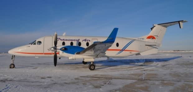 A Transwest Air plane sits at the Prince Albert Airport in a 2015 file photo. A Transwest Air medevac plane had to make an unscheduled landing in Prince Albert on Saturday. (Transwest Air - image credit)