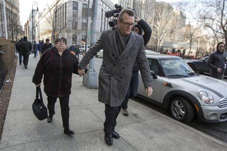 Annette Bongiorno (L), former portfolio manager for Bernard L. Madoff Investment Securities LLC, exits the Manhattan Federal Court house in New York, March 24, 2014. REUTERS/Brendan McDermid