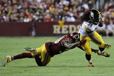 Sep 12, 2016; Landover, MD, USA; Pittsburgh Steelers running back DeAngelo Williams (34) carries the ball as Washington Redskins safety David Bruton Jr. (30) attempts the tackle in the third quarter at FedEx Field. The Steelers won 38-16. Mandatory Credit: Geoff Burke-USA TODAY Sports