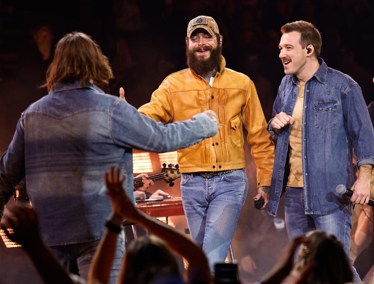 HARDY, left, Post Malone, center, and Morgan Wallen perform during the 57th Annual Country Music Association Awards in Nashville, Tennessee, Wednesday, Nov. 8, 2023.