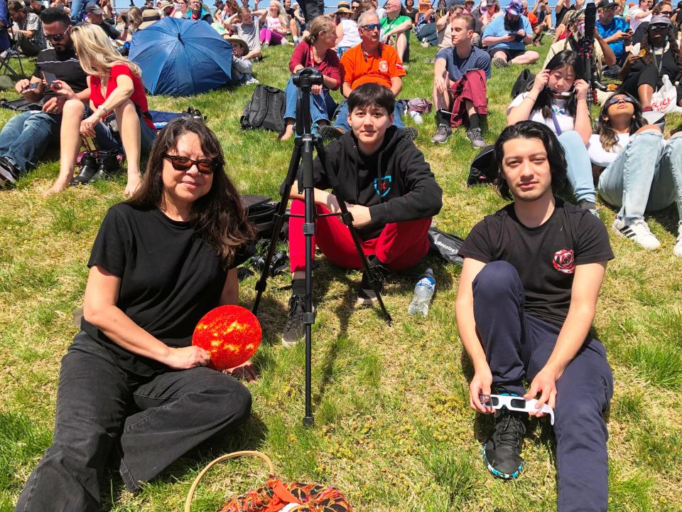 Zoila Natera-Sandoval with her son, Diego, 20, and daughter, Monique, 18, drove from their North Riverside, Illinois home to Carbondale to see the total eclipse at Salukie Stadium on Monday, April 8, 2024.