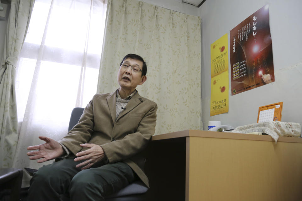 In this March 15, 2017 photo, Shinjiro Shishido, director of "Inochinodenwa", non-profit telephone hotline for people seek help, speaks during an interview, in Tokyo. Fewer Japanese are taking their own lives, a glimmer of hope in a country with one of the world’s highest suicide rates. The number of suicides has dropped for seven straight years in a clear indication of a downward trend. The Health Ministry said Thursday, March 23, 2017, that 21,897 people committed suicide in 2016, down from more than 30,000 in 2011. (AP Photo/Koji Sasahara)